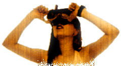 swiss performance artist looking at the ceiling through huge goggles while demonstrating a net bikini